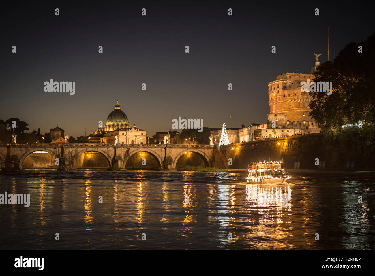 Illuminated bridge over river, Rome, Italy Stock Photo