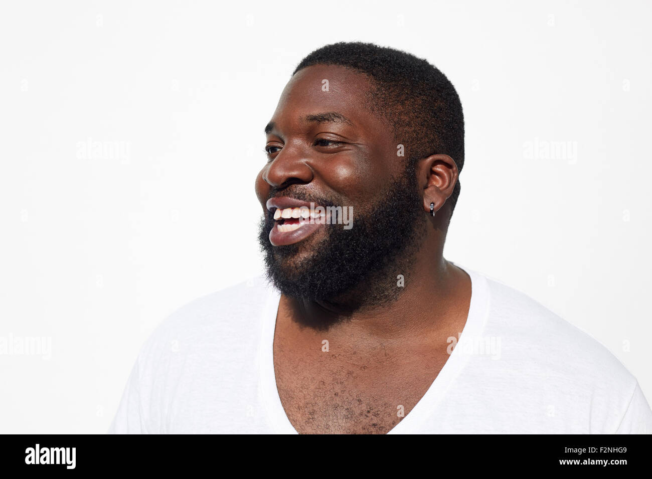 Close up of smiling Black man with beard Stock Photo