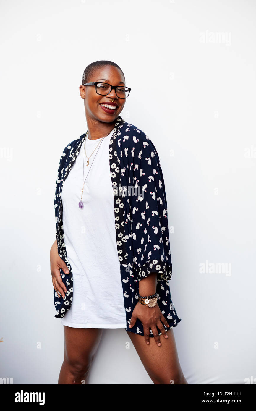 Stylish Black woman posing in dress Stock Photo