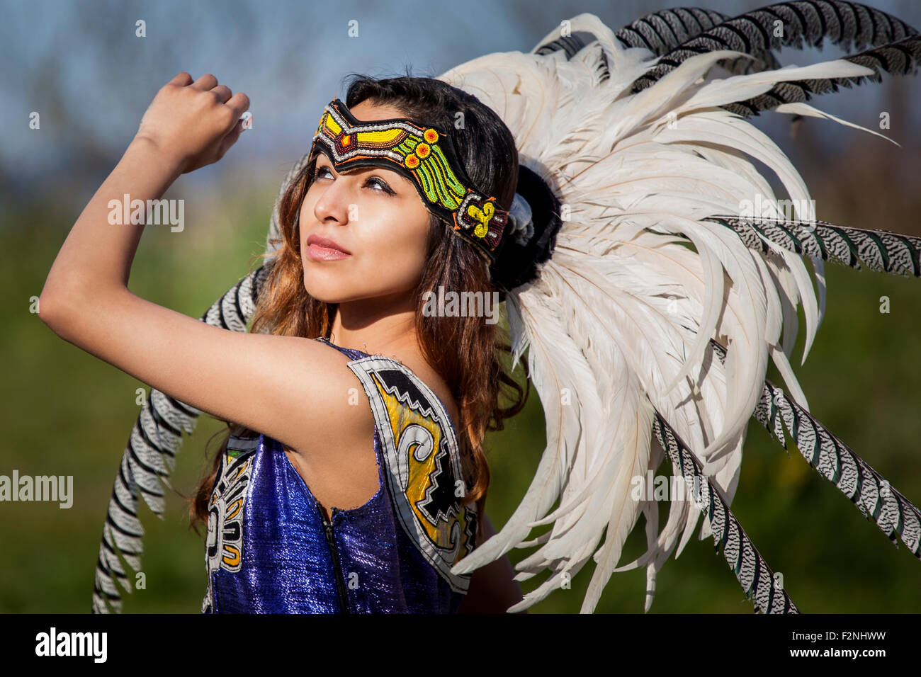 Native American woman in traditional headdress performing ceremony ...
