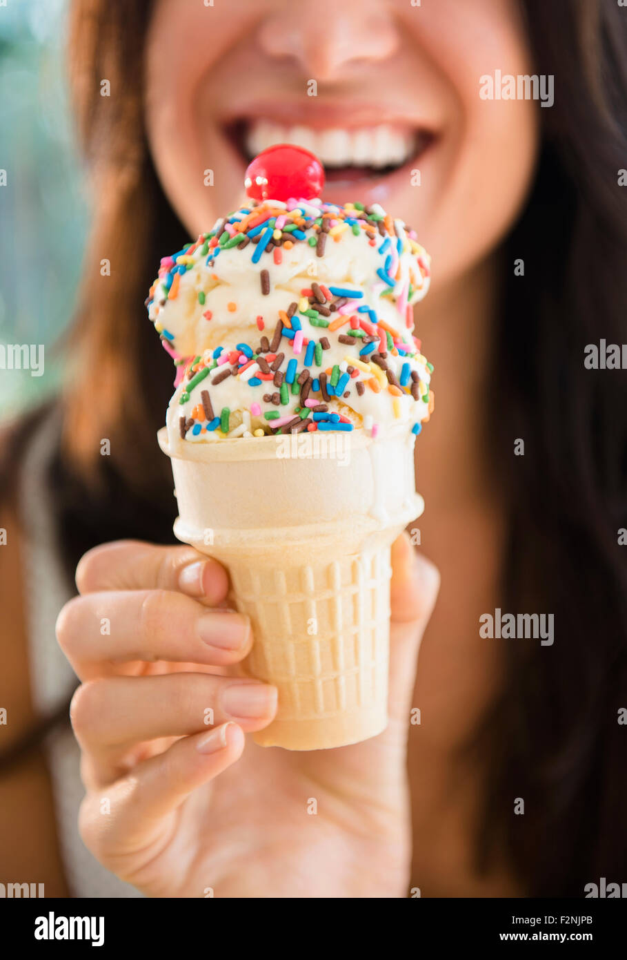 Close up of woman holding ice cream cone Stock Photo