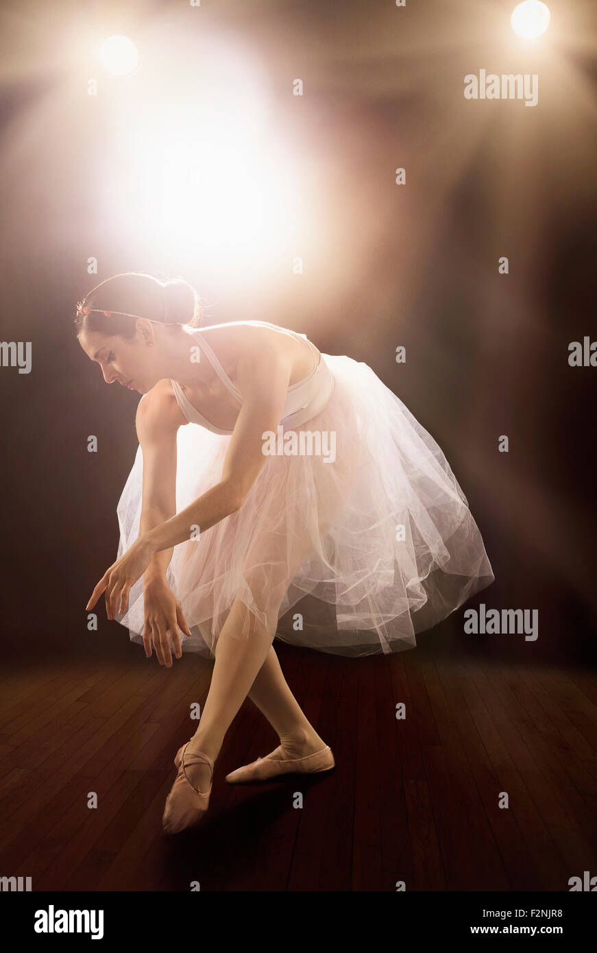 Hispanic ballet dancer performing on stage Stock Photo