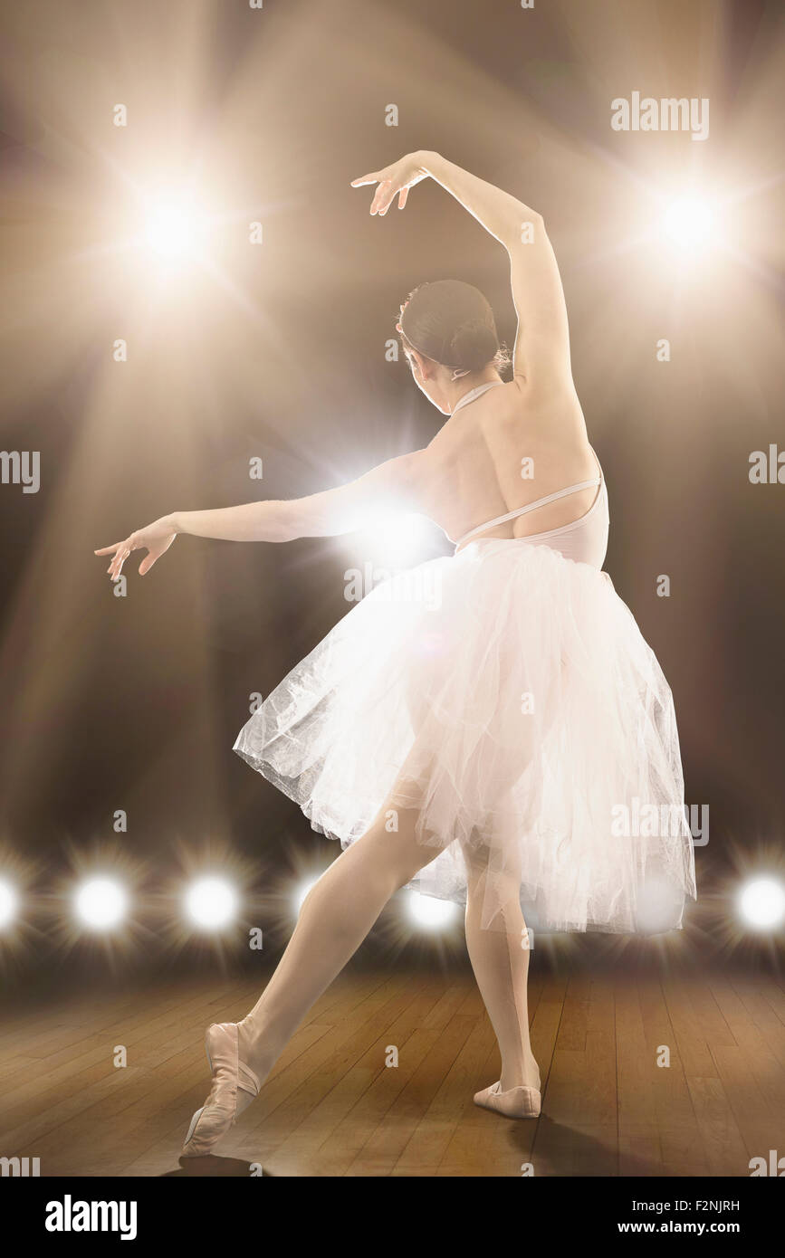 Hispanic ballet dancer performing on stage Stock Photo