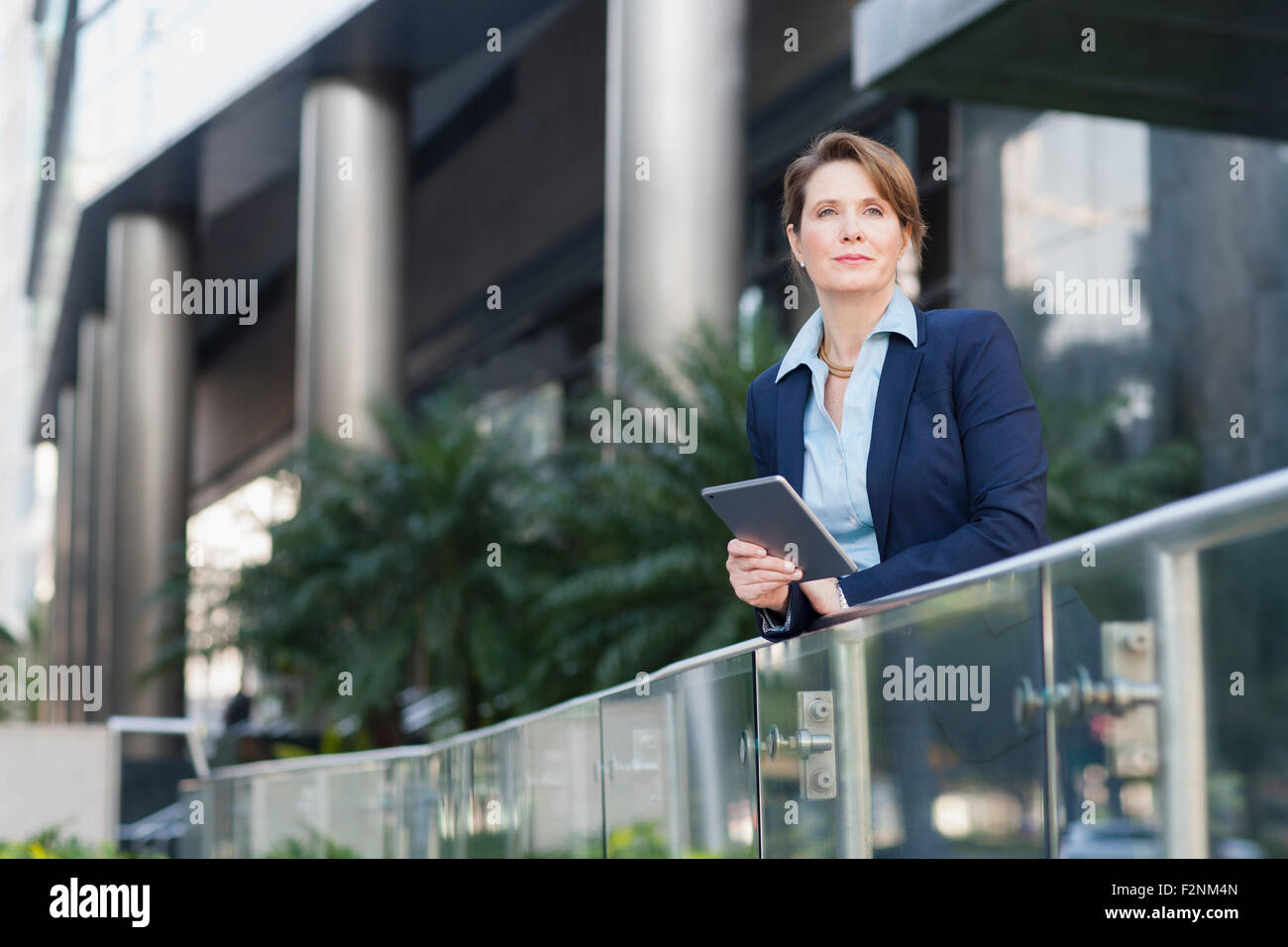 Caucasian businesswoman using digital tablet outdoors Stock Photo