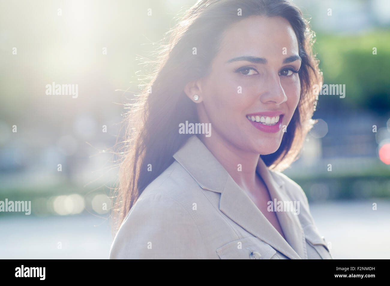Hispanic businesswoman smiling outdoors Stock Photo
