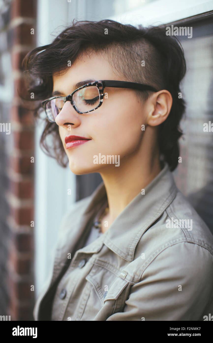 Close up of Caucasian woman with eyes closed Stock Photo