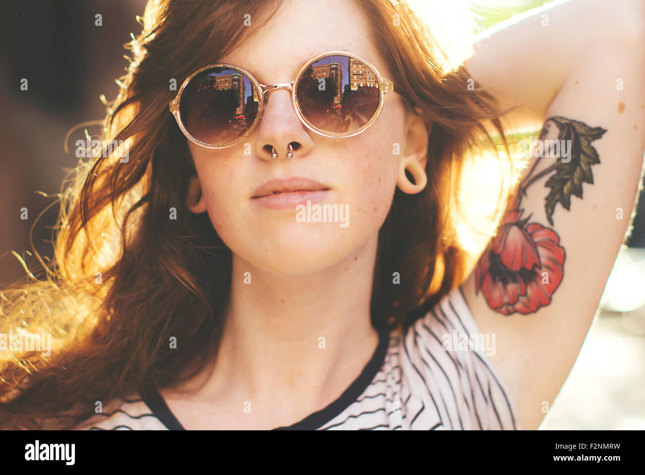 Caucasian woman wearing sunglasses outdoors Stock Photo