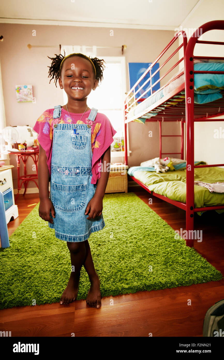 Black girl smiling in bedroom Stock Photo - Alamy