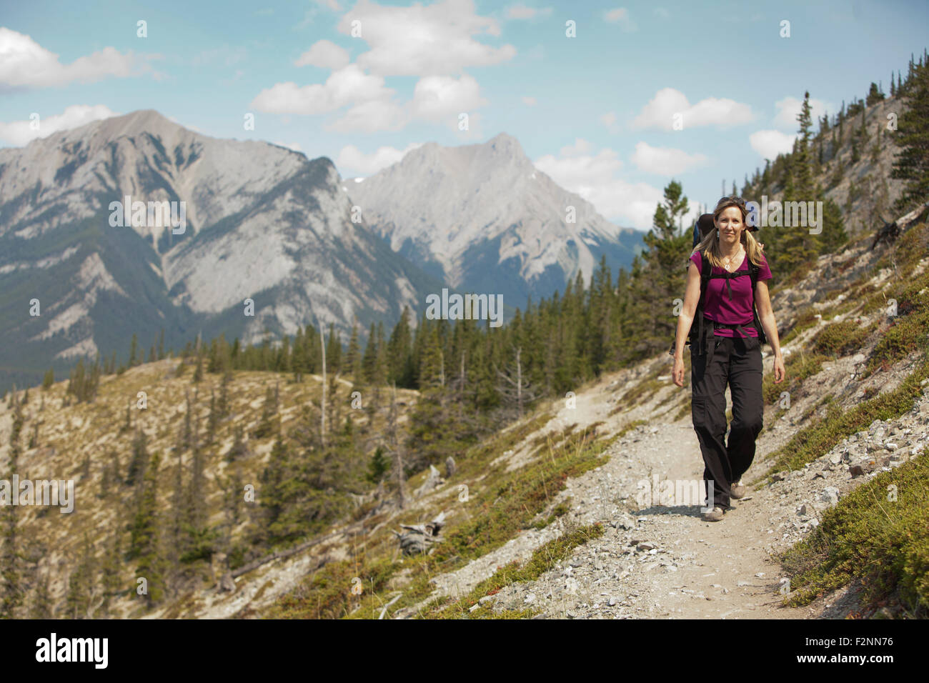 Mature woman hiking on trail hi-res stock photography and images - Alamy
