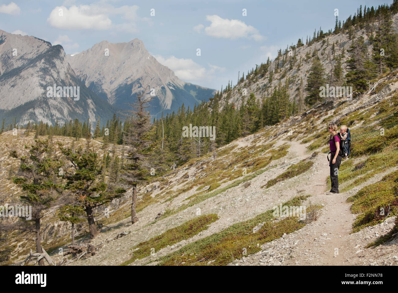 Caucasian mother and son hiking on remote hillside Stock Photo