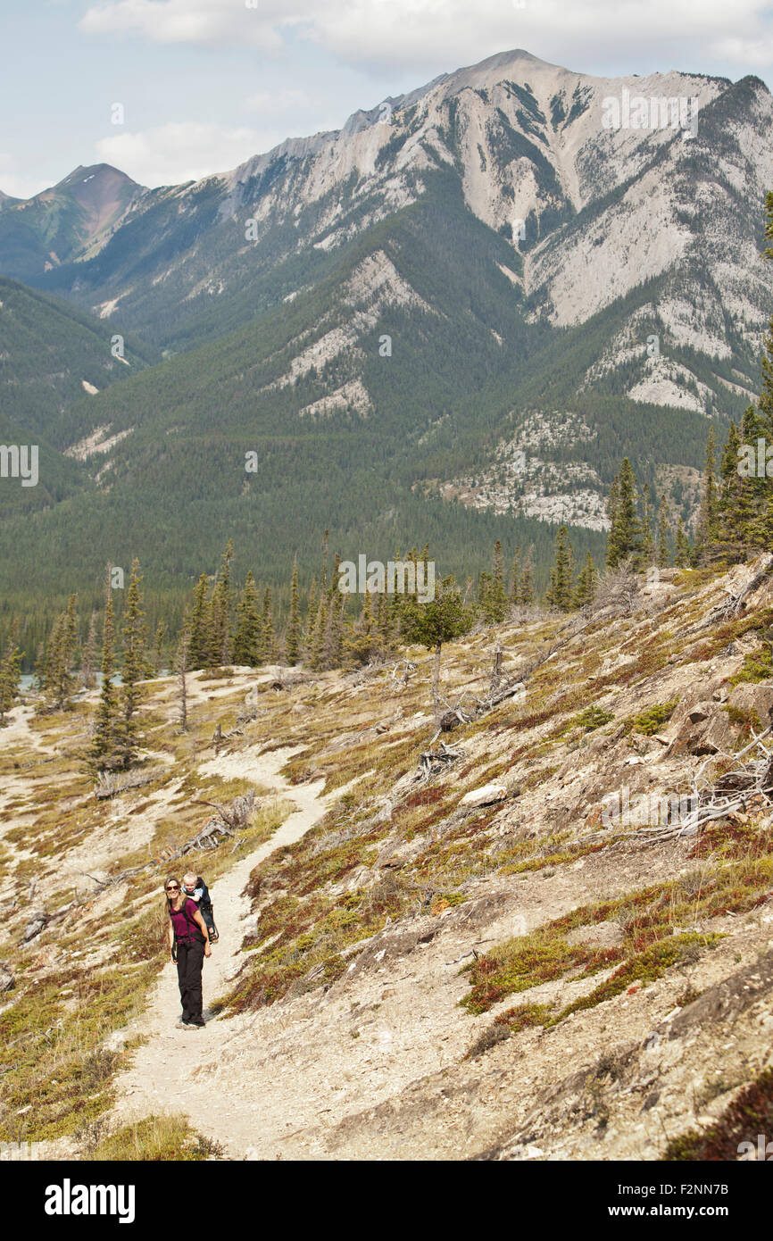 Caucasian mother and son hiking on remote hillside Stock Photo