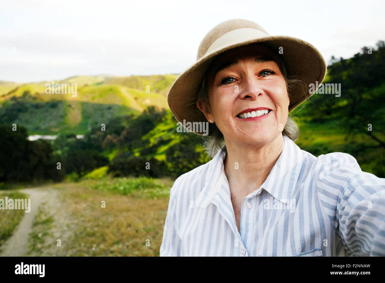 Caucasian woman standing on hiking trail Stock Photo - Alamy