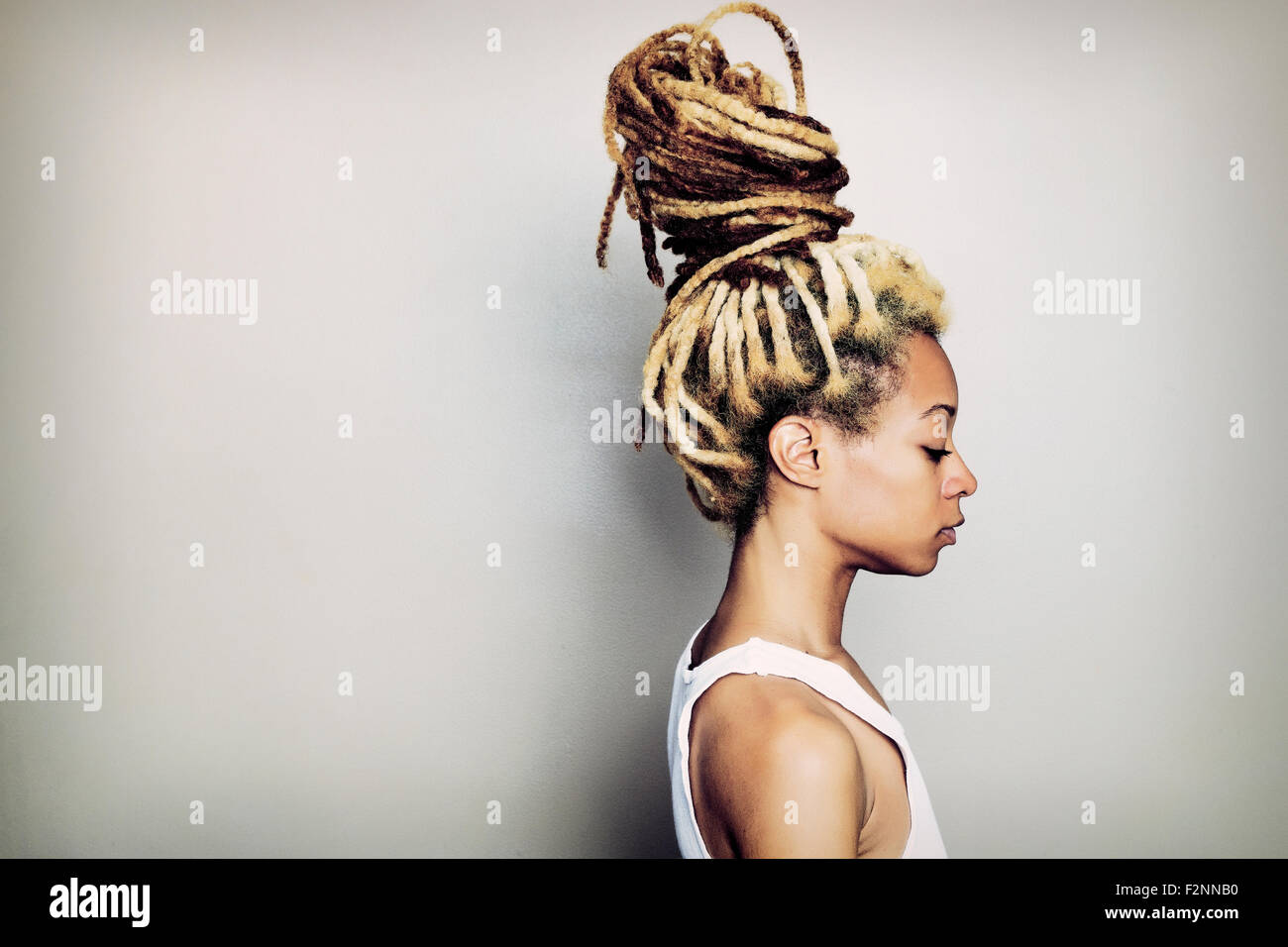 Black woman with dreadlocks bun Stock Photo