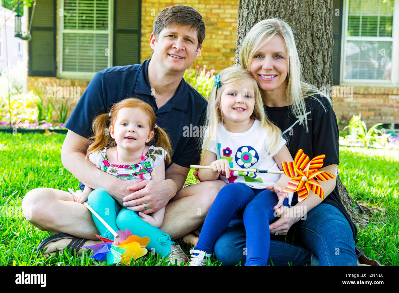 Caucasian family smiling in backyard Stock Photo