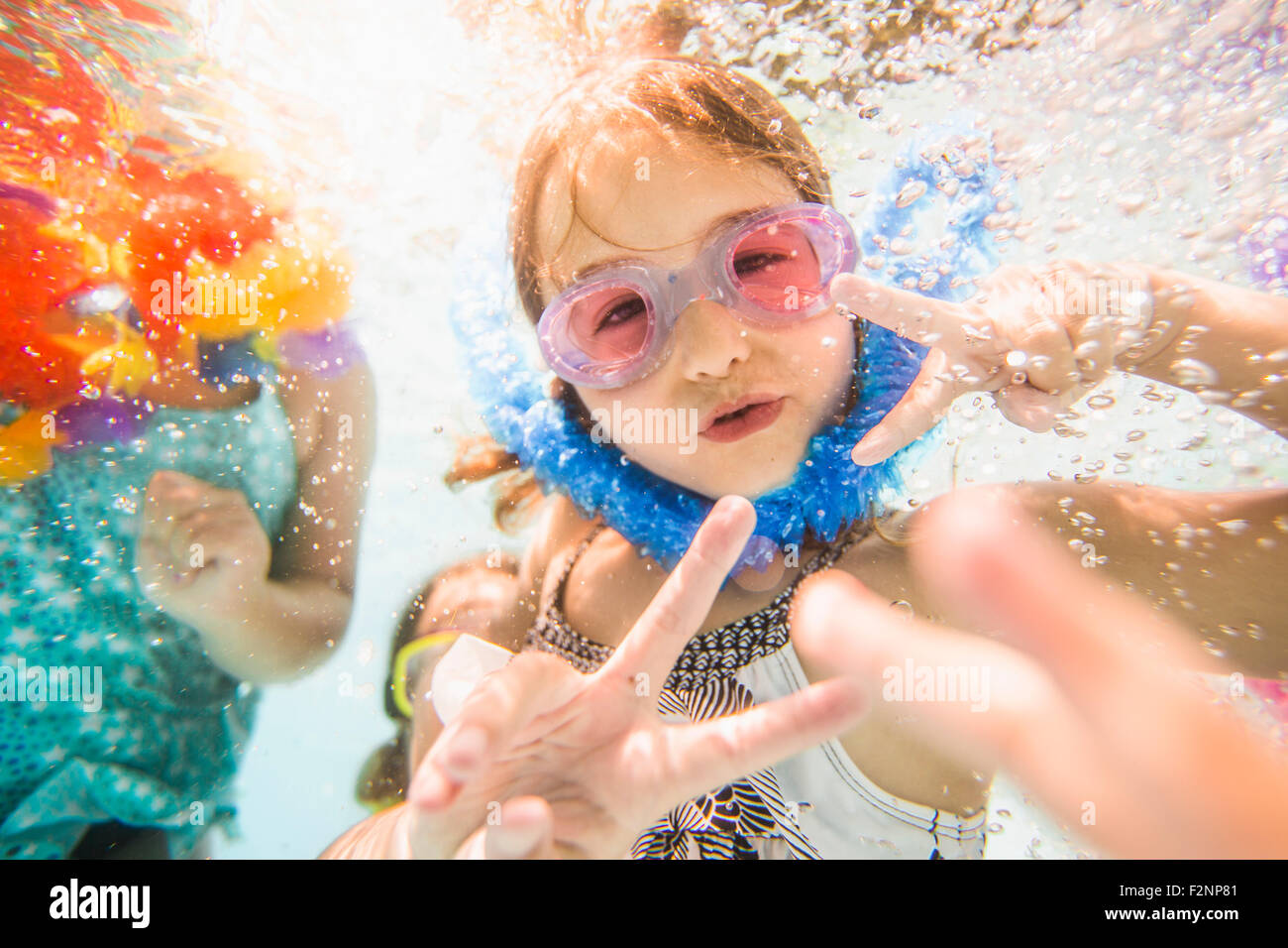 Caucasian children swimming underwater in swimming pool Stock Photo Alamy