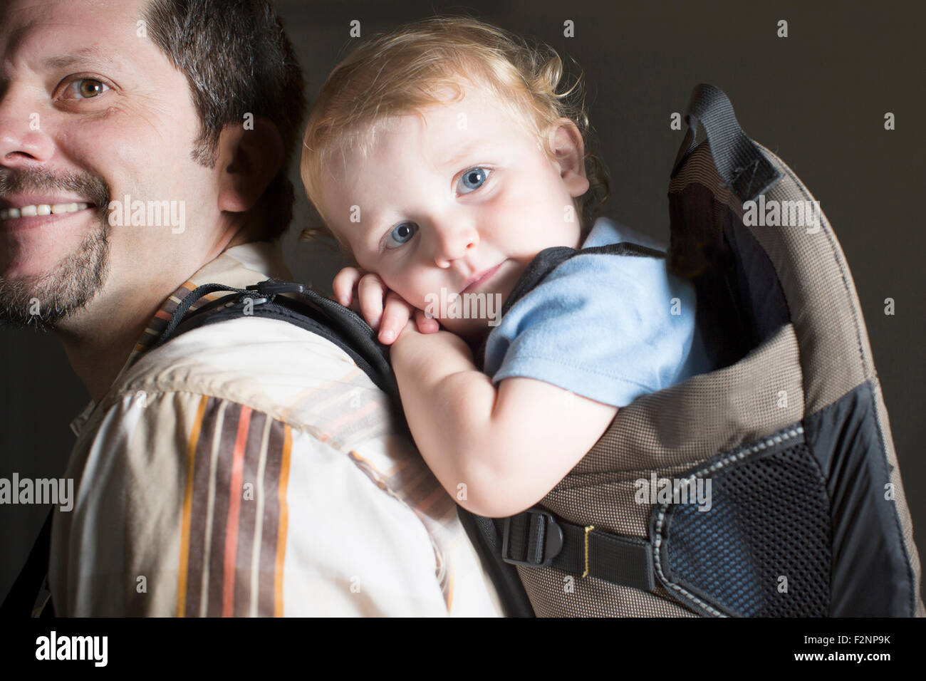 Caucasian father carrying son on back Stock Photo