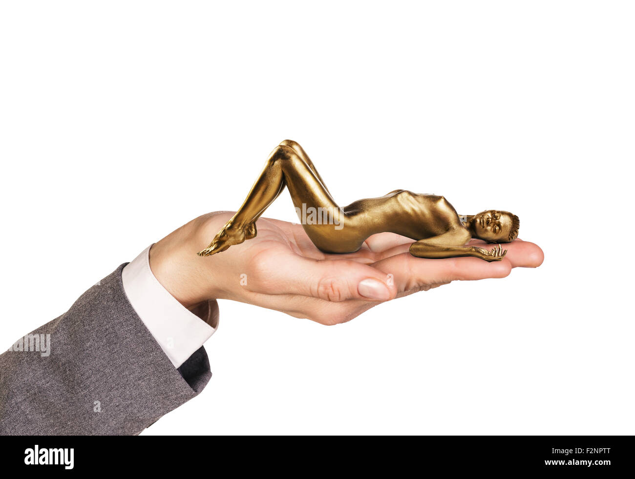 Open palm holds woman with gold skin Stock Photo