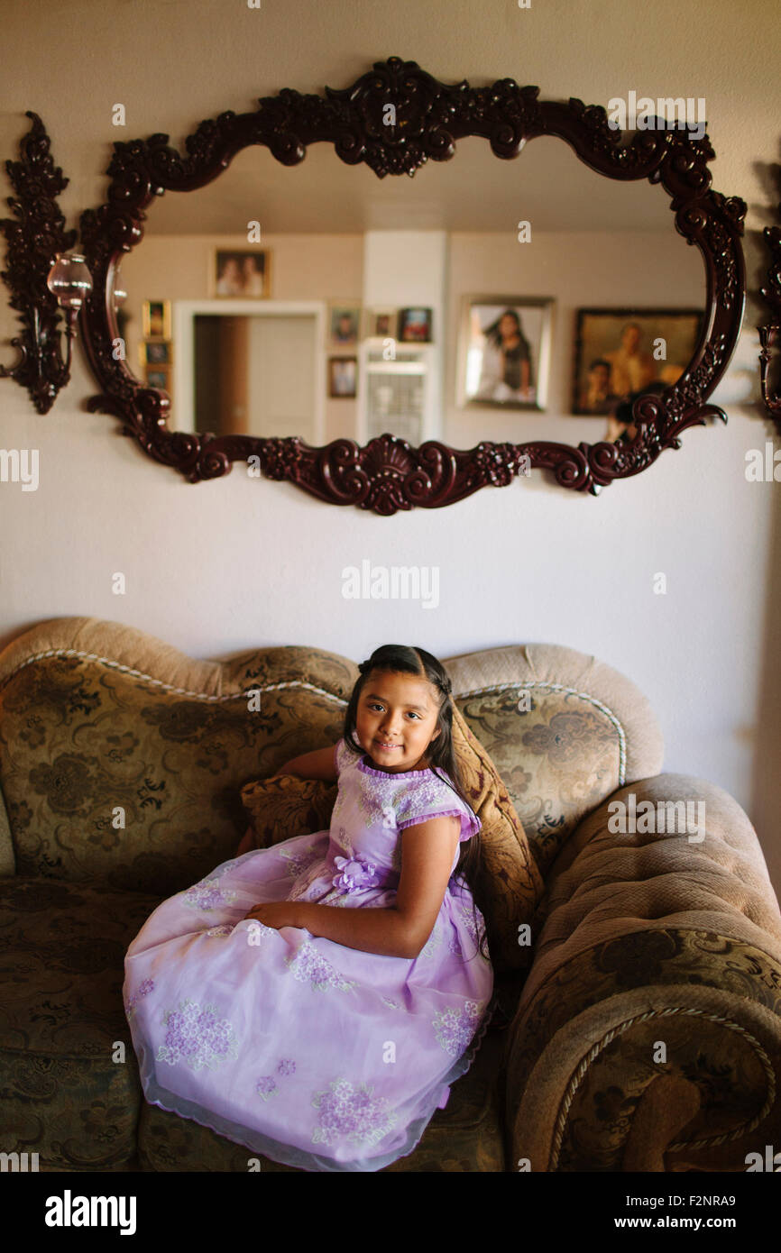 Happy child girl sitting sofa hi-res stock photography and images - Alamy