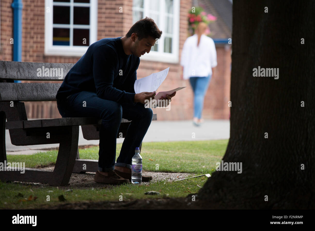 A student reads his A Level results after they have just been announced Stock Photo