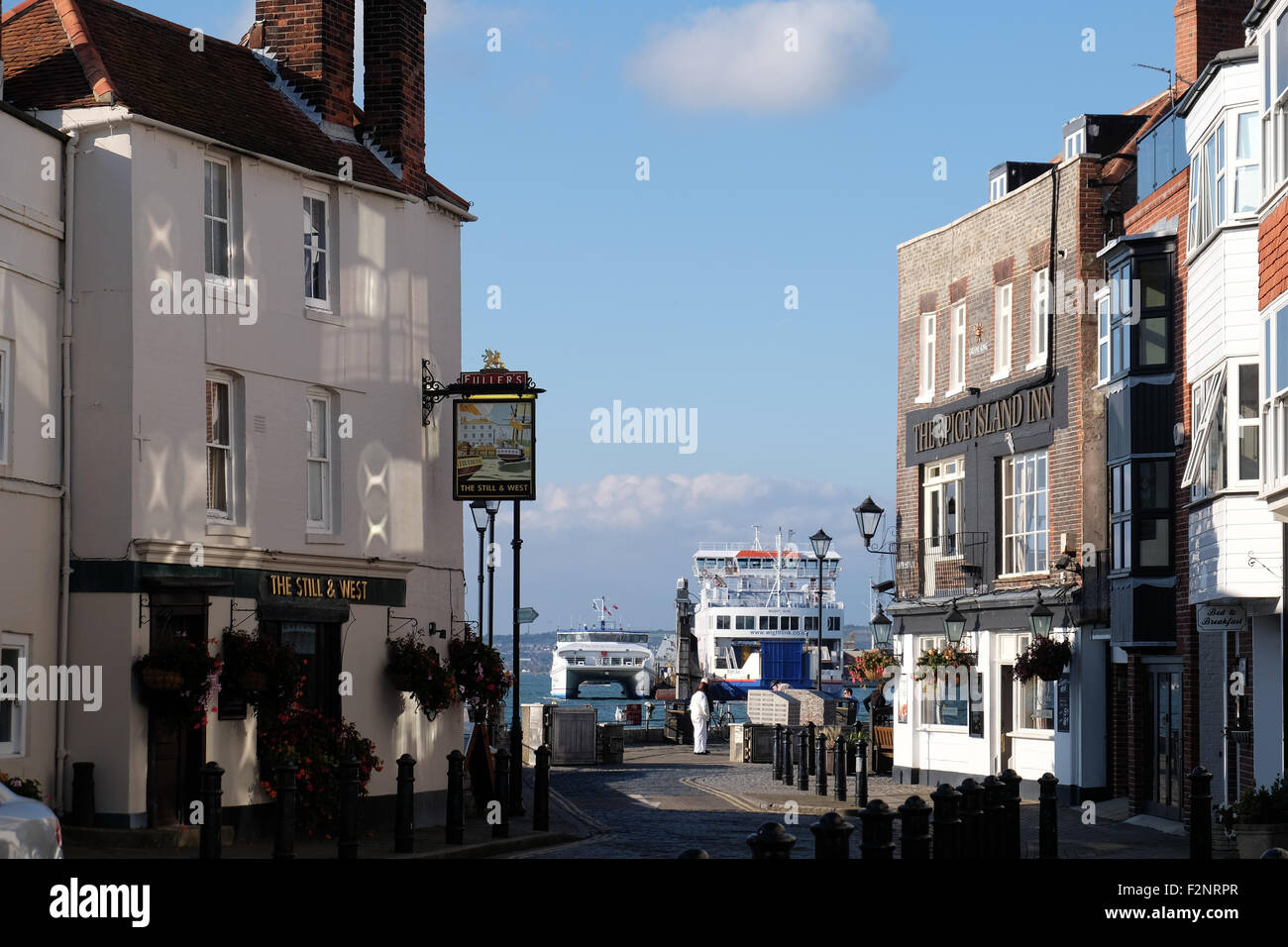 A view of the Still & West Pub, two Wightlink Ferries and the Spice Island Inn from Old Portsmouth Stock Photo