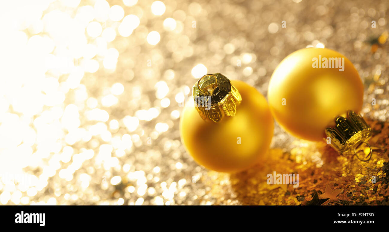 Golden Christmas balls on glitter background Stock Photo - Alamy
