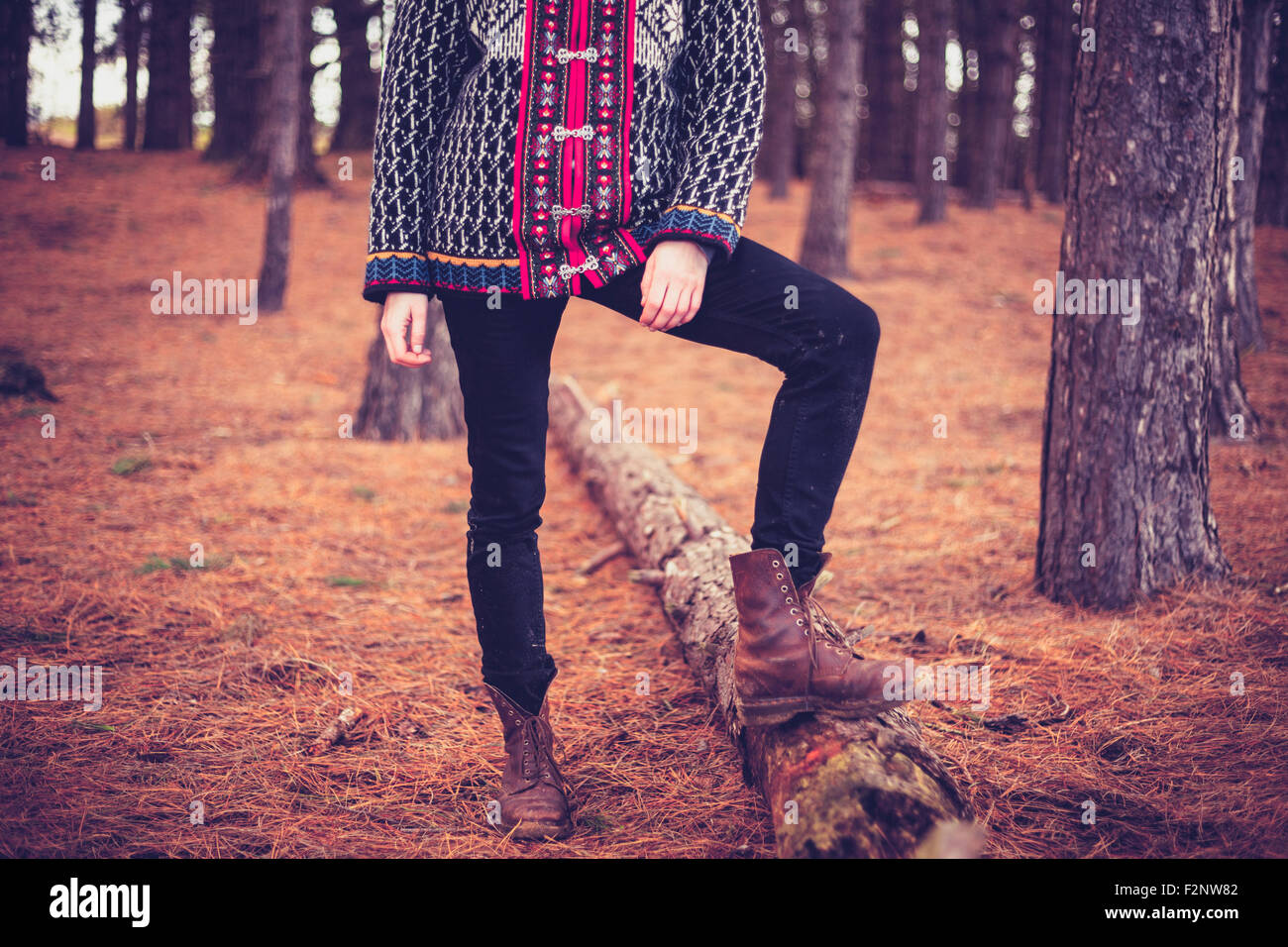A young woman is standing in a forest Stock Photo - Alamy