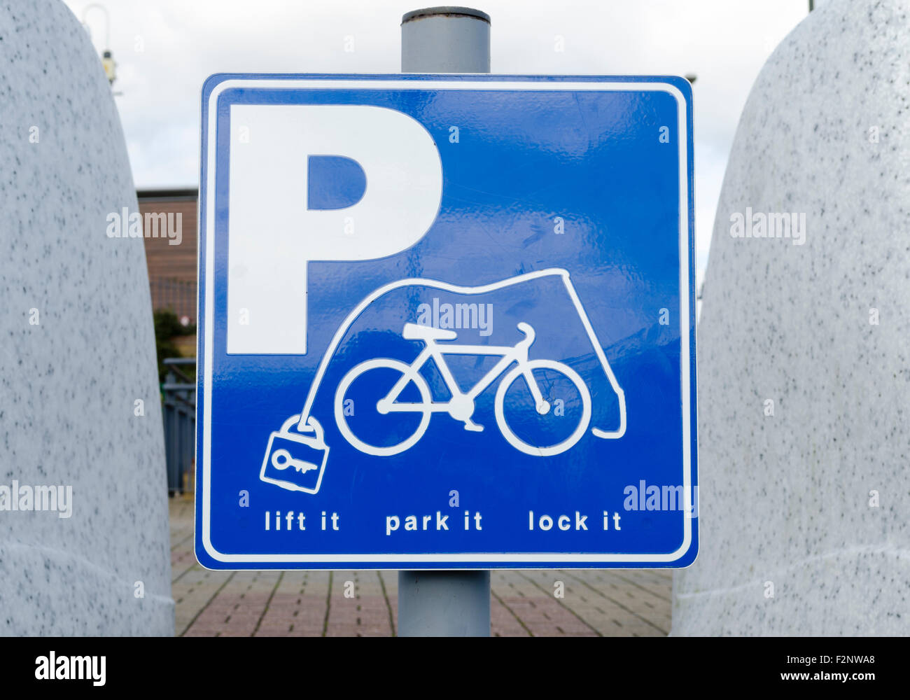 Sign pointing to bicycle parking area Stock Photo