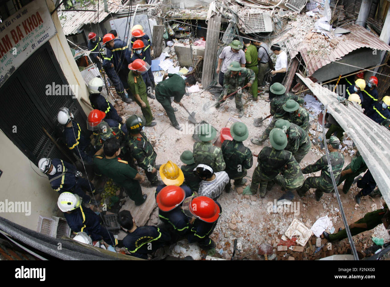 Hanoi, Vietnam. 22nd Sep, 2015. Rescuers Work At The Site Of A Building ...