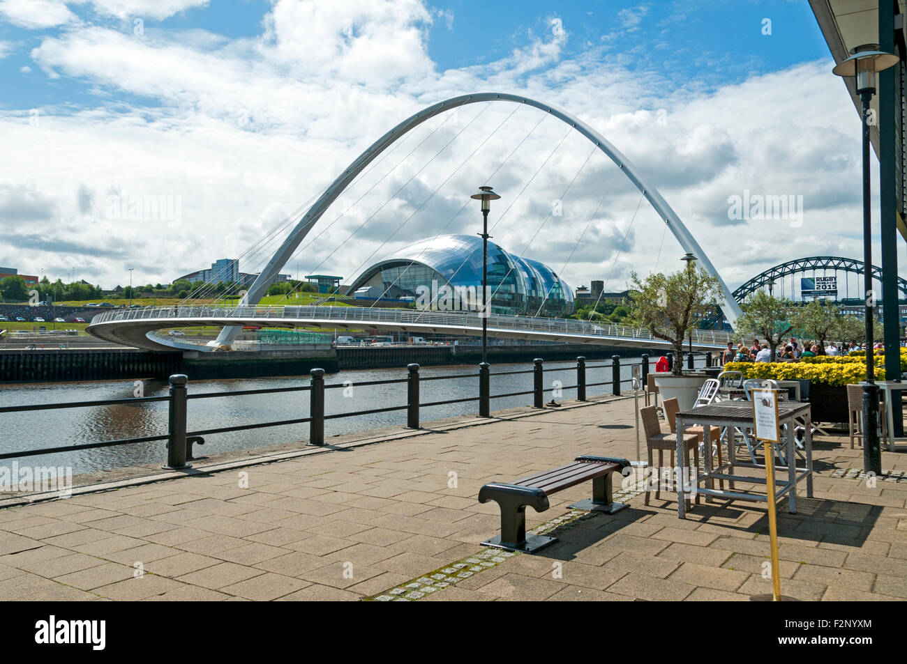 The Gateshead Millennium Bridge and the Sage Centre over the river Tyne, Newcastle-Gateshead, Tyne and Wear, England, UK. Stock Photo