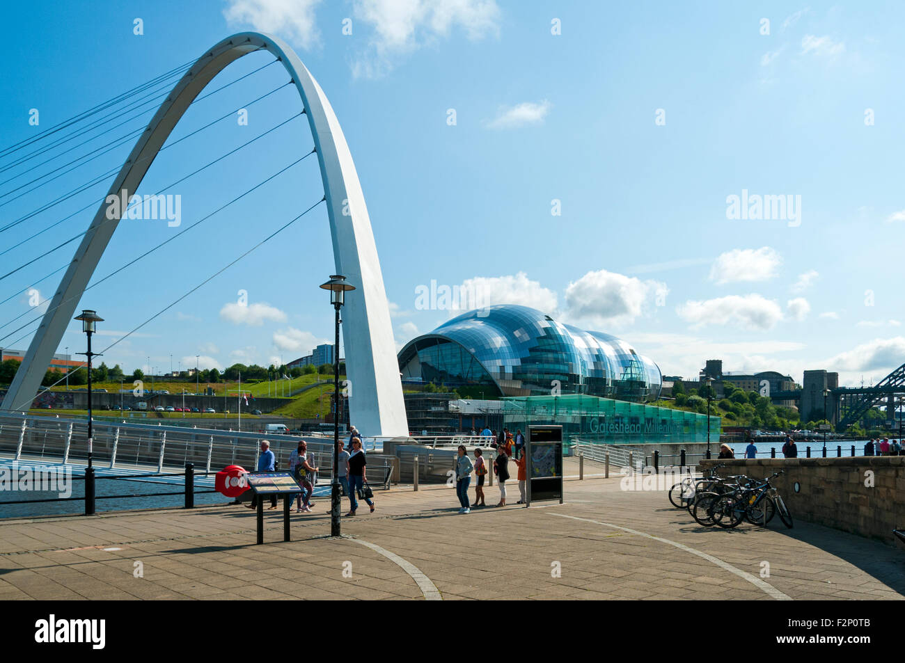 The Sage Centre and Gateshead Millennium Bridge, over the river Tyne, Newcastle-Gateshead, Tyne and Wear, England, UK. Stock Photo