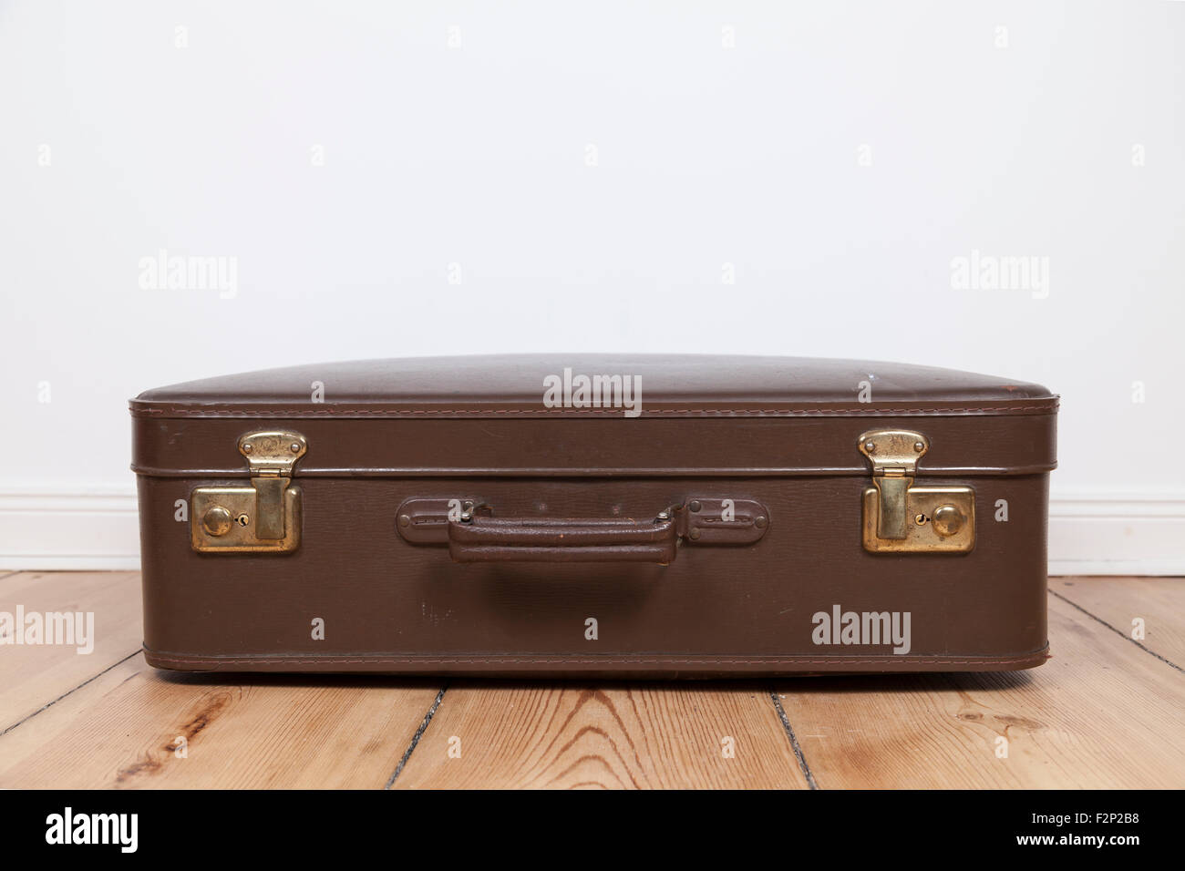 old fashioned suitcase on floor Stock Photo