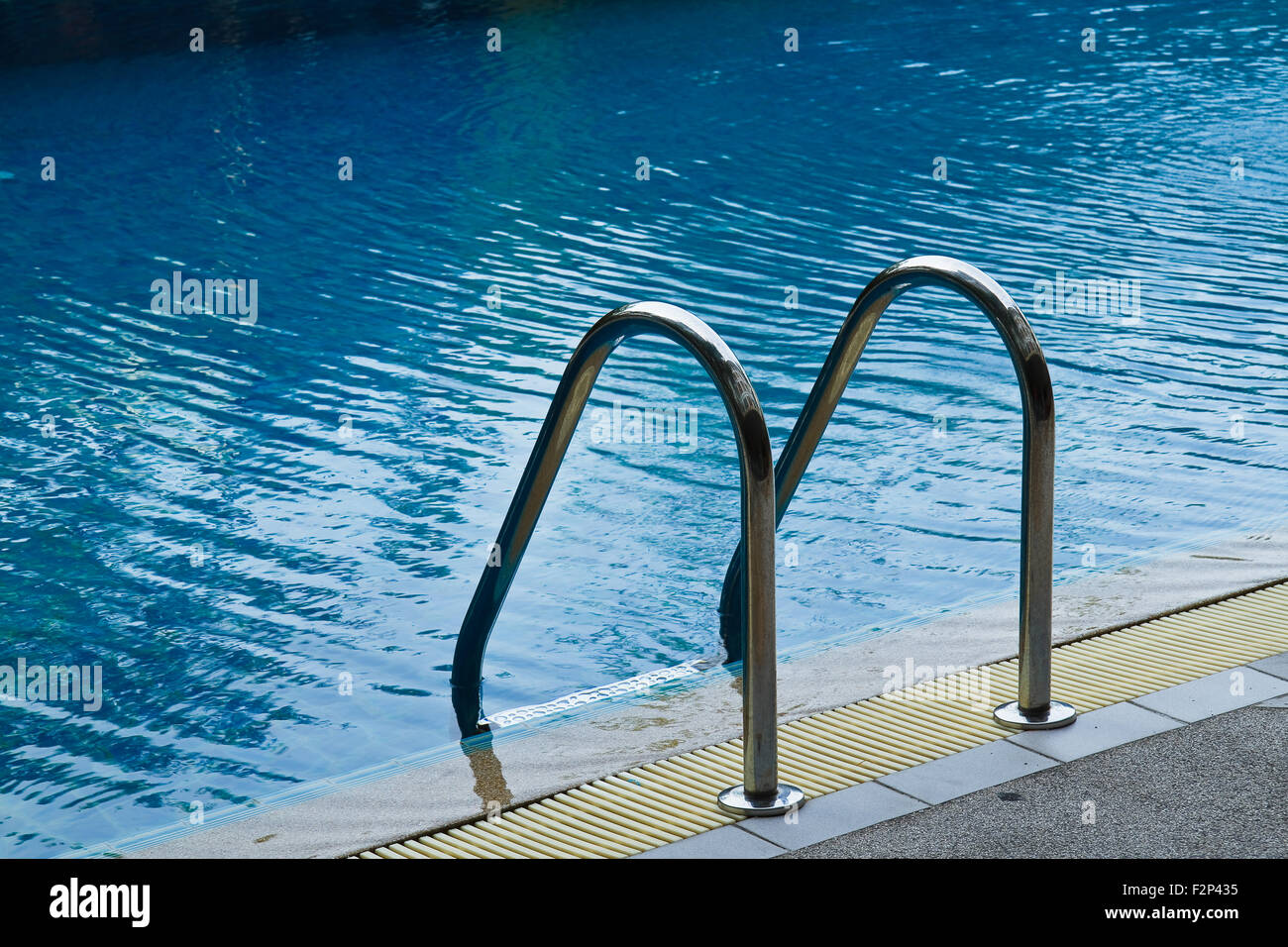 Grab bars ladder in swimming pool Stock Photo Alamy