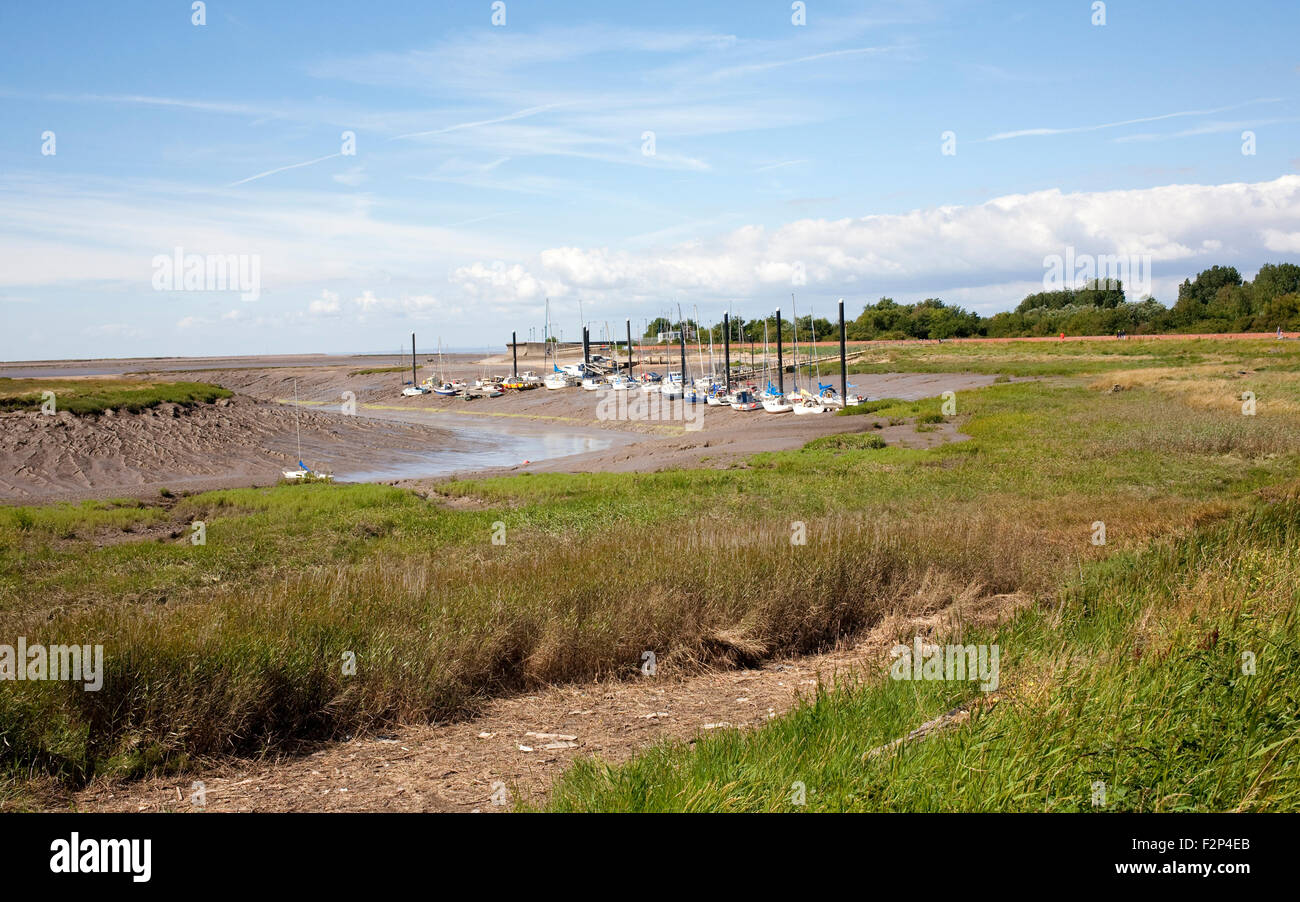 the marina in Burnham on sea with boats moored during low tide Stock Photo