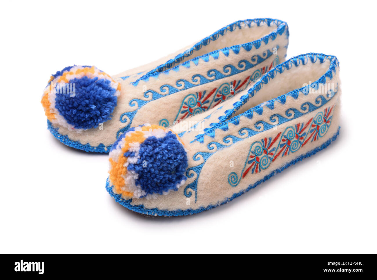Traditional greek woollen handmade slippers isolated on white Stock Photo