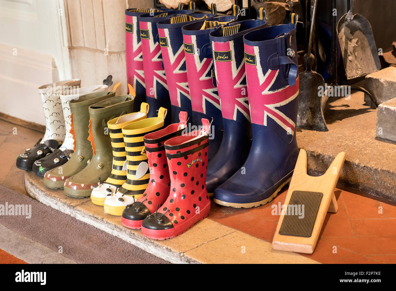 Collection of Wellington boots in a mud room in English country house Stock Photo
