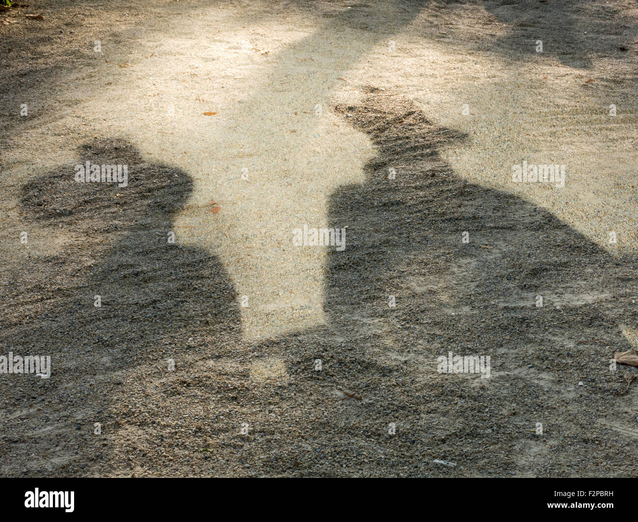 Shadow Outline of Couple with Wide Brimmed Hats,  Battery Park, NYC, USA Stock Photo