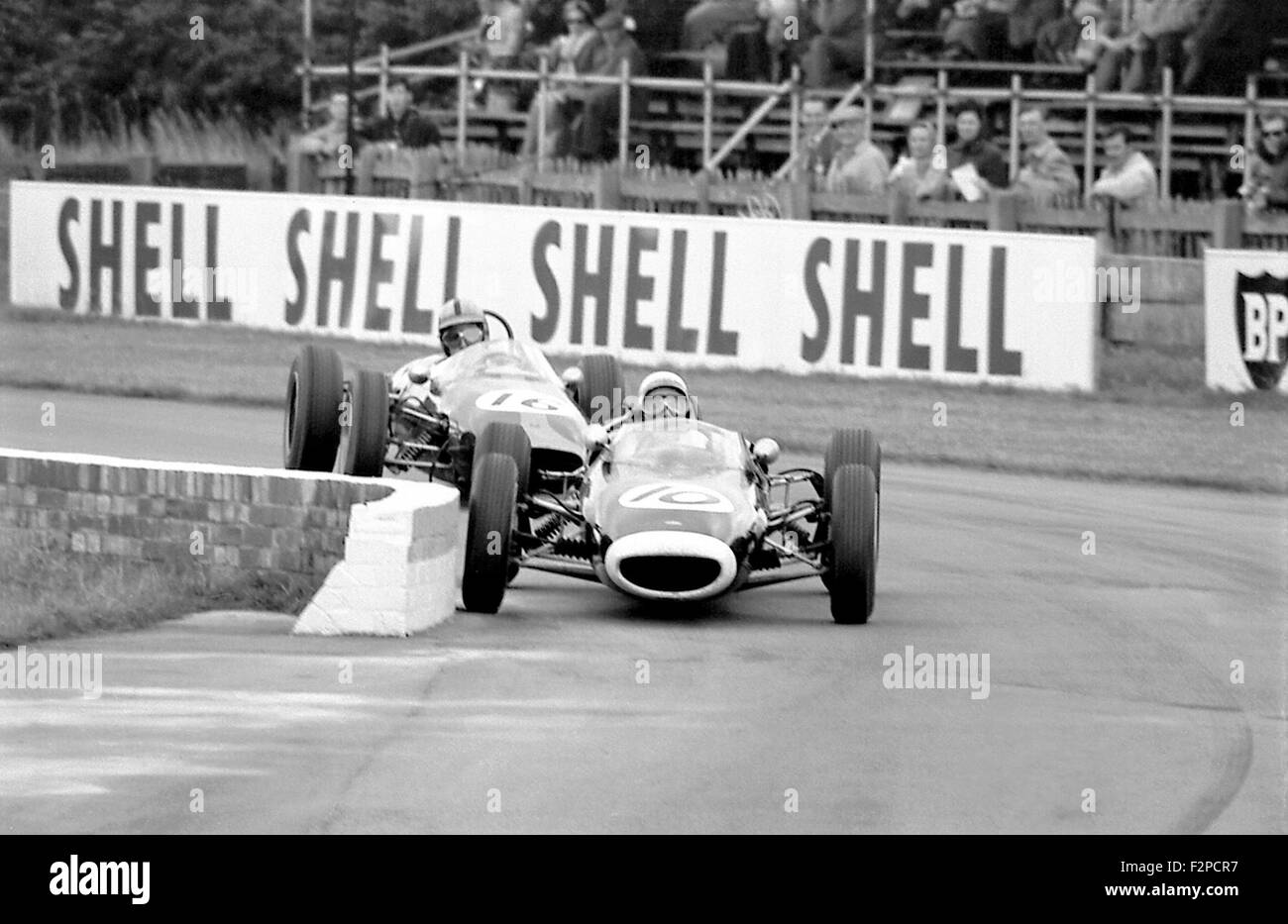 Richard Attwood in a Lola and Frank Gardner in a Brabham in a Formula Junior race Goodwood 1963 Stock Photo
