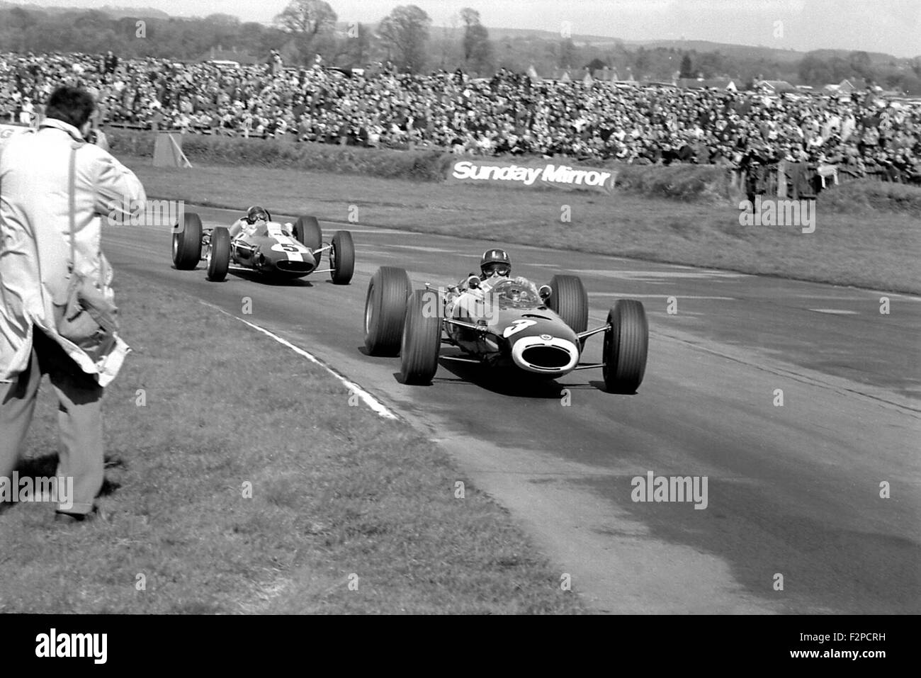 Graham Hill in a BRM leading Jim Clark in a Lotus at Goodwood 1965 Stock Photo