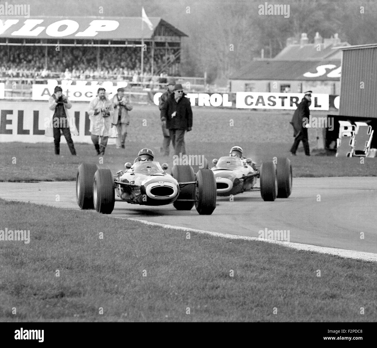 Graham Hill and Jackie Stewart racing in BRMs at Goodwood 1965 Stock Photo