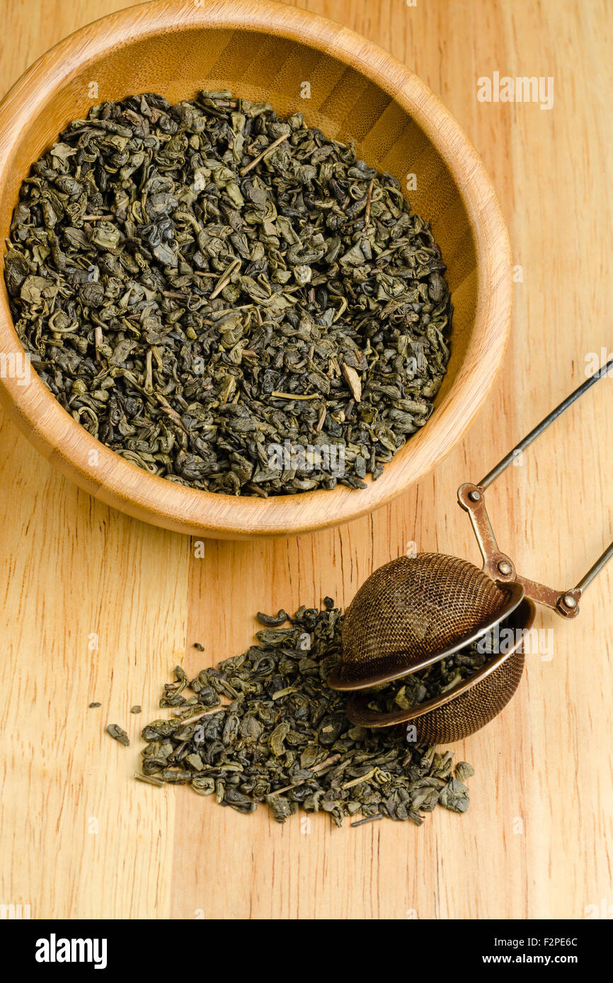 green tea, dried leaves with filter, on wooden background Stock Photo Alamy