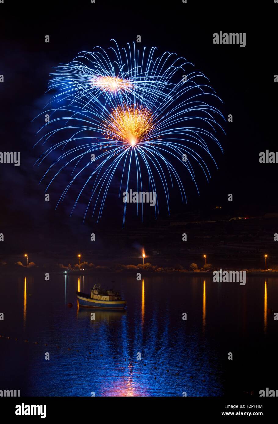 Blue colors amazing fireworks in Malta with the dark sky background Stock Photo