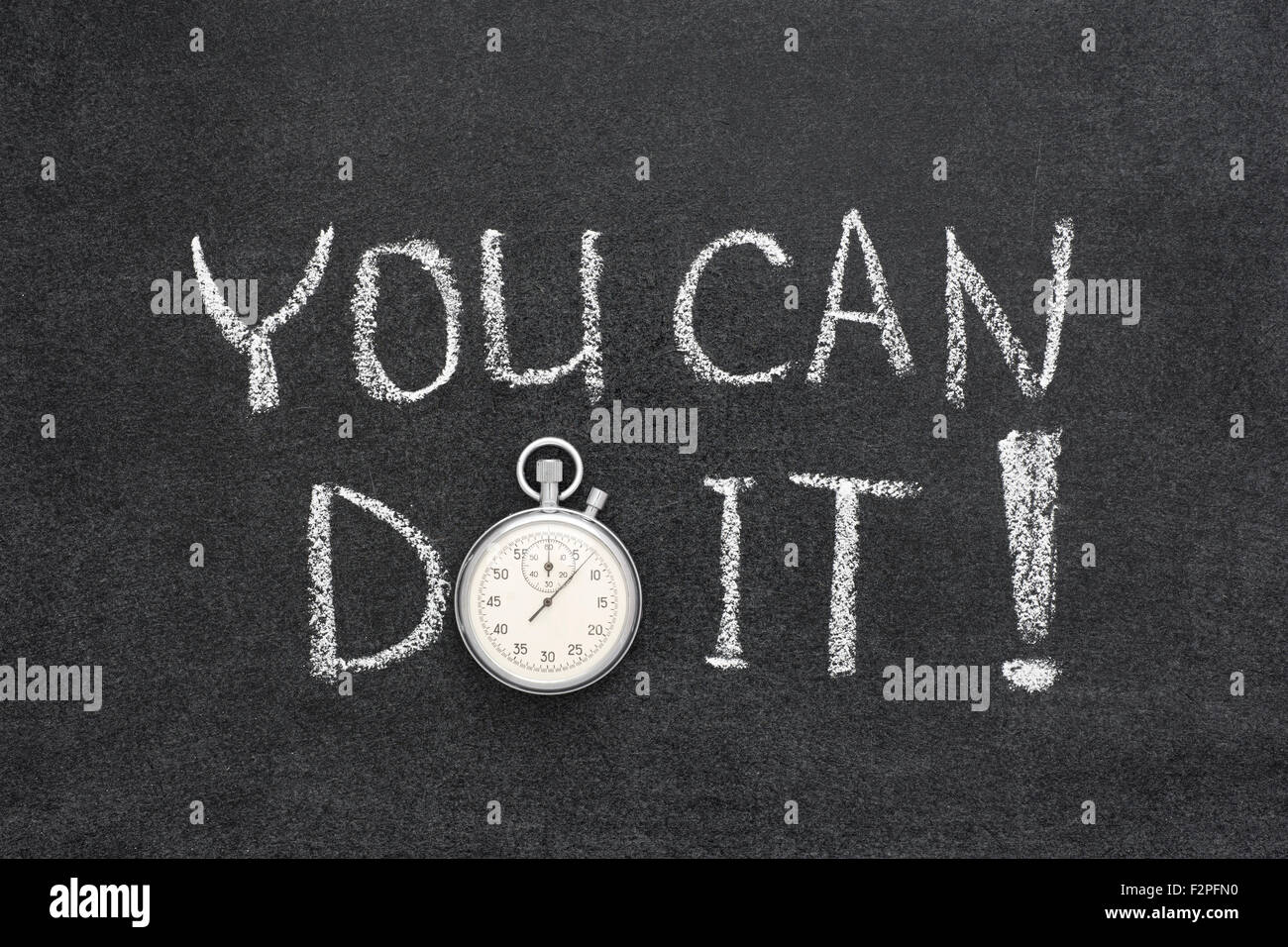 you can do it exclamation handwritten on chalkboard with vintage precise stopwatch used instead of O Stock Photo