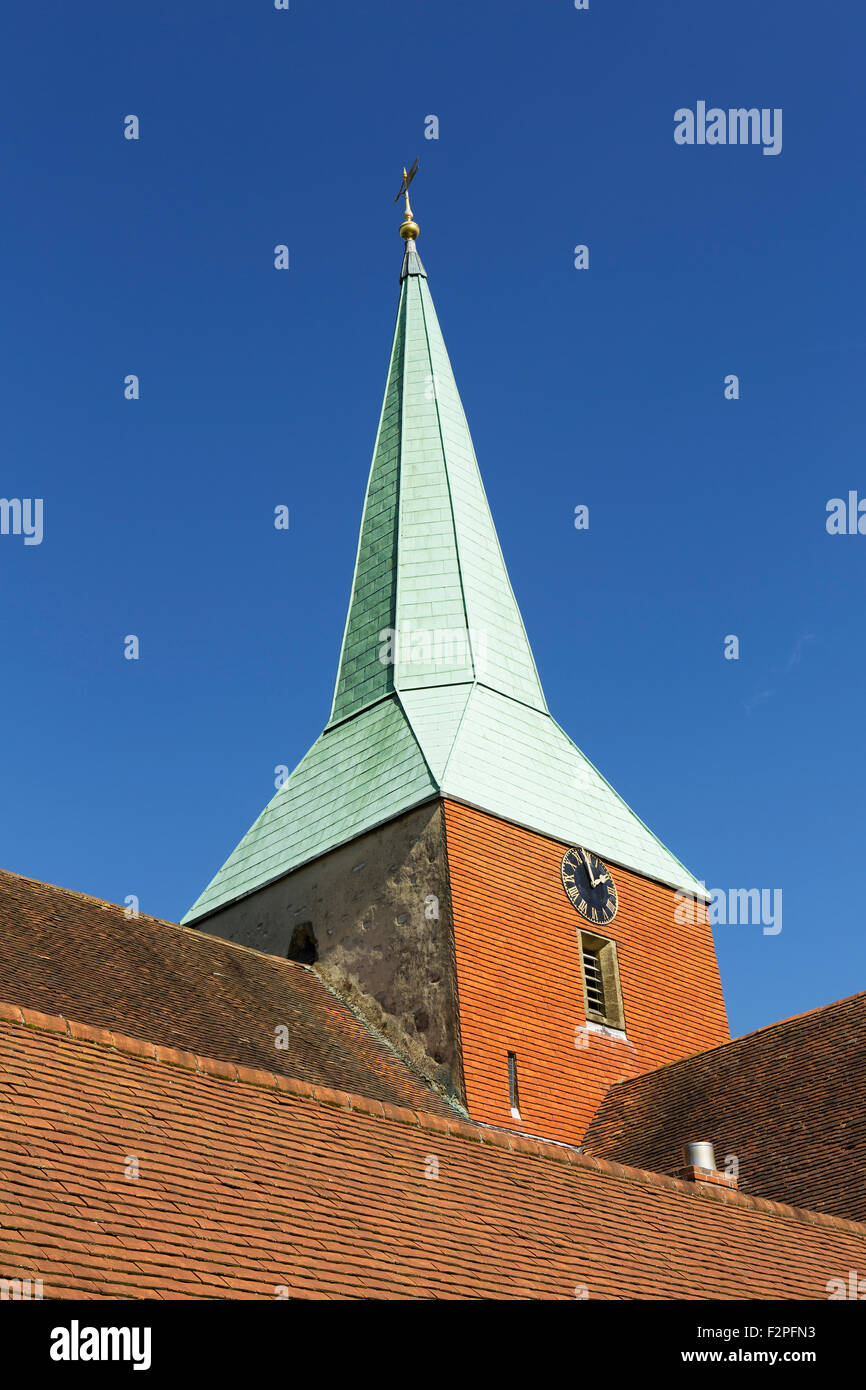 St Mary and St Gabriel church in the village of South Harting in West Sussex. Showing the detail of the clock and spire. Stock Photo