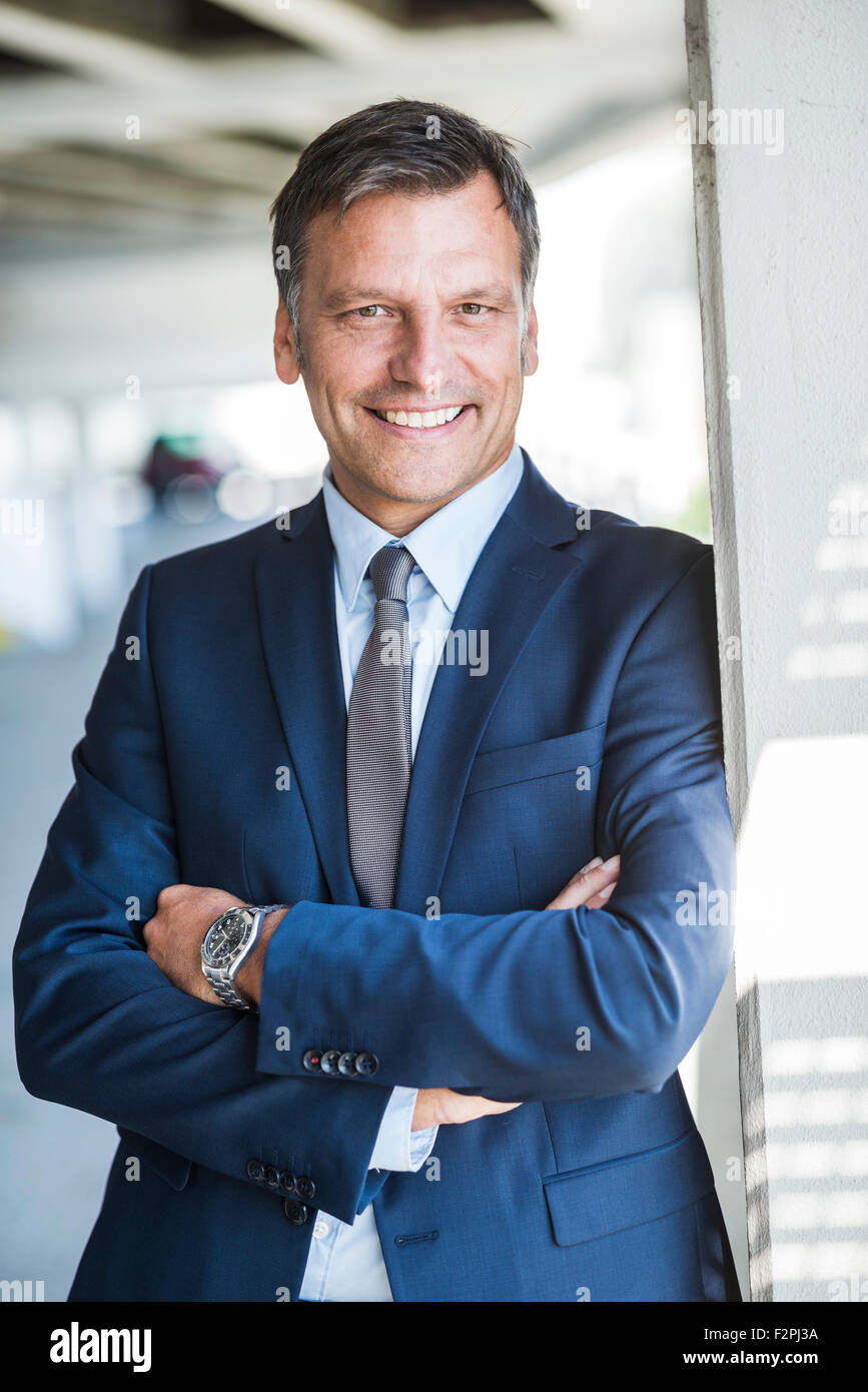 Mature businessman smiling confidently, portrait Stock Photo