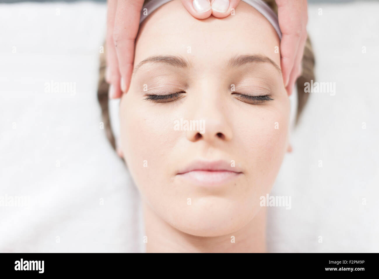 Cosmetician giving facial massage Stock Photo Alamy