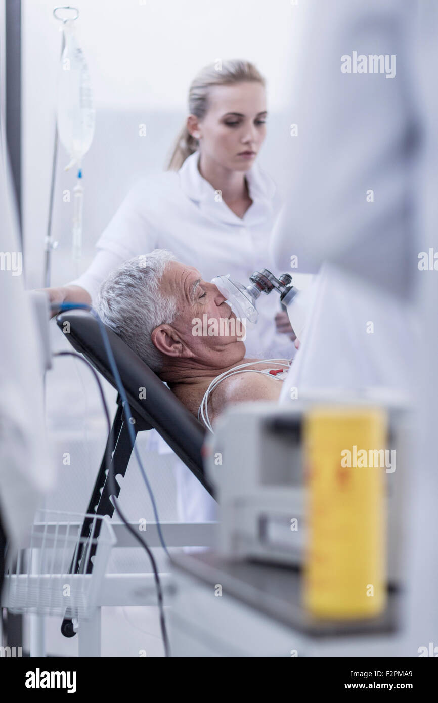 Hospital staff helping patient in emergency Stock Photo
