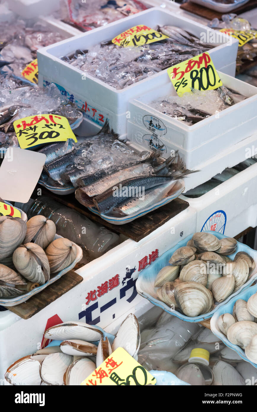 Selection of fresh shellfish and fish on a Japanese market stall in Tsukiji market Stock Photo