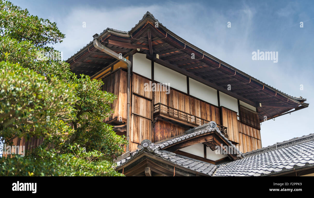 A traditional style Japanese wooden building with a tile roof Stock Photo