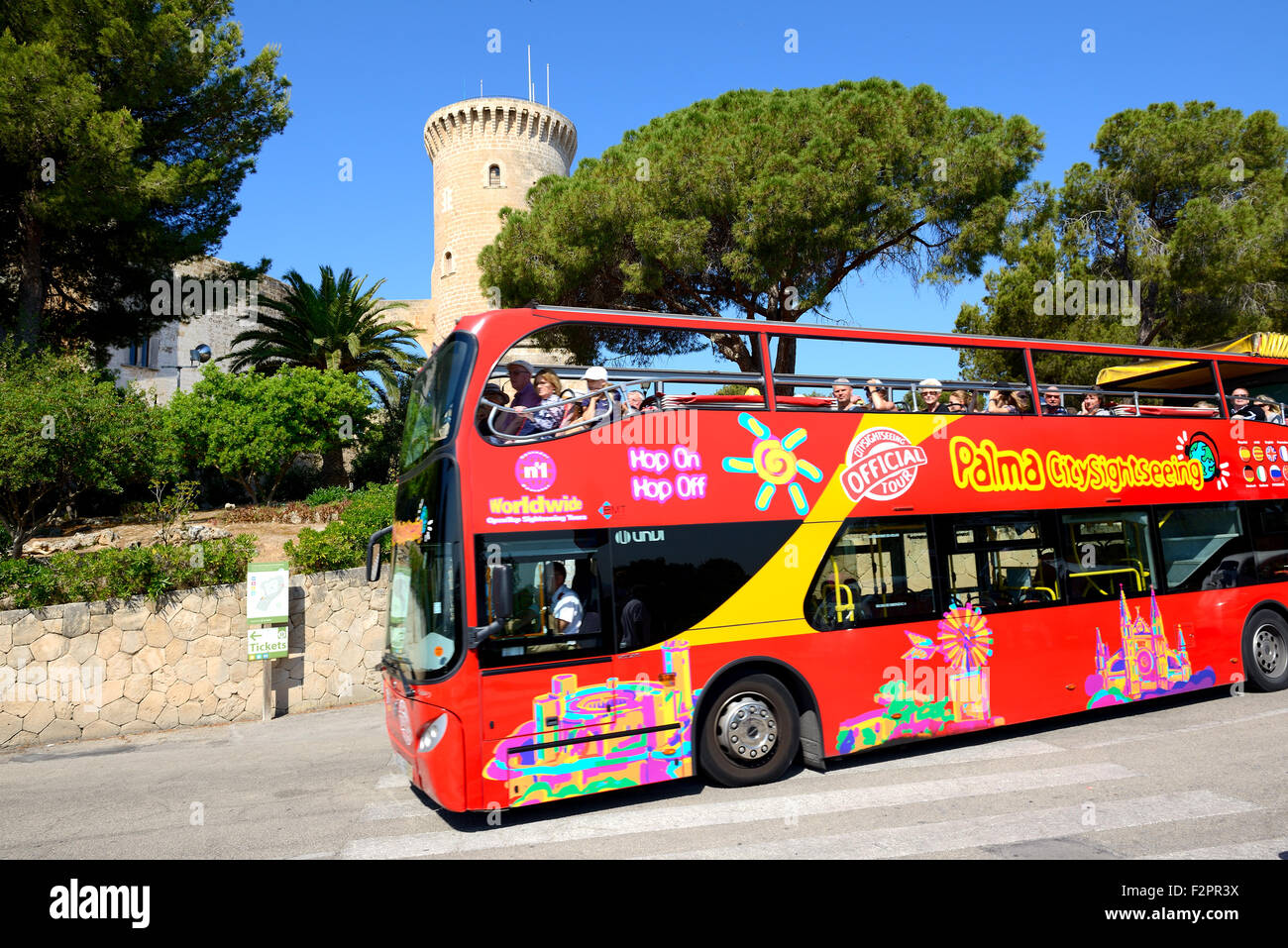 The tourists enjoying their vacation on the city sight seeing bus, Mallorca, Spain. Stock Photo