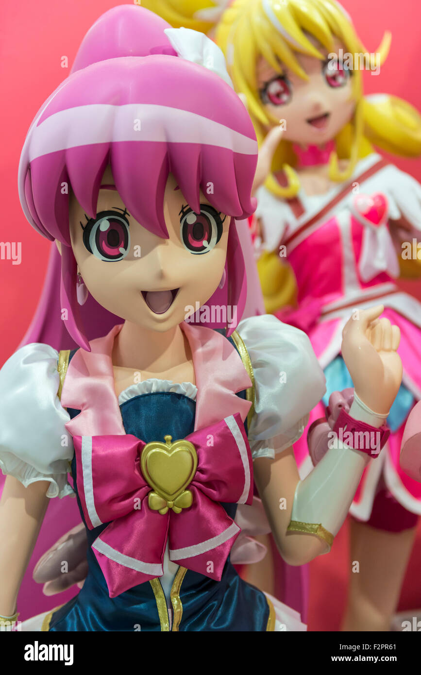 A large 3D model of a colourful Japanese anime girl character in a display of manga style art Stock Photo